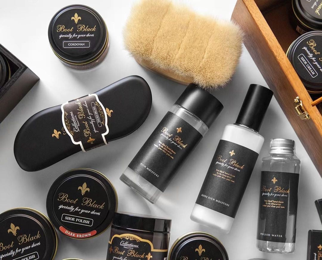 Assortment of Boot Black shoe care creams, polish, brushes and conditioners