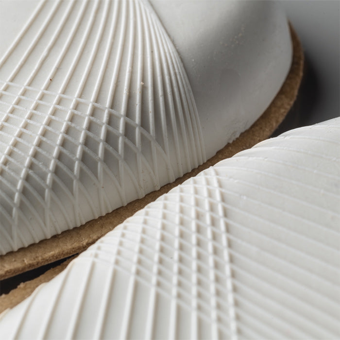 Side view of the shaped leather Pedag Heel Lift