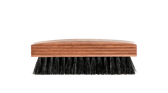 Wooden-handled shoe brush with black bristles for leather shoe care and polishing