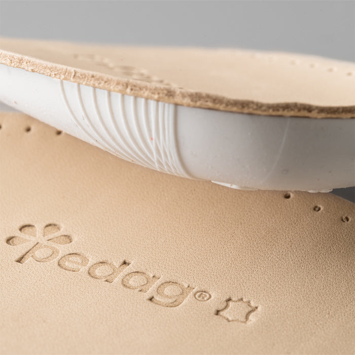 Contoured Pedag Heel Lift designed to raise and cushion the heel
