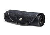 Black leather shoe care kit roll with white stitching and snap closure, ideal for storing polish and brushes