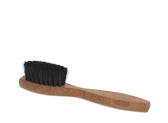 Wooden-handled shoe brush with black bristles for leather shoe care and polishing