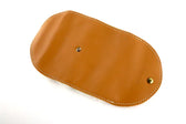Tan leather shoe shine pouch with white stitching and brass snap closure for premium shoe care