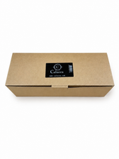Calnora branded kraft box for leather care products, featuring elegant black label with logo and website.