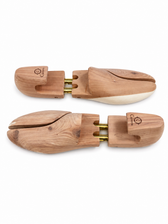 Pair of Calnora wooden shoe trees with adjustable split toes.