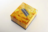 Saphir leather care product box with honeycomb design and bee logo, featuring premium shoe polish and conditioning