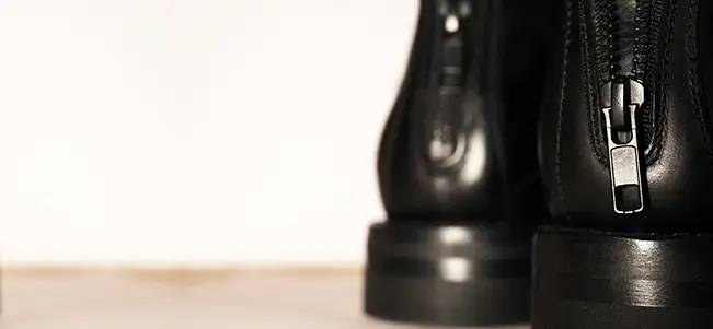 Leather boot zipper craftsmanship